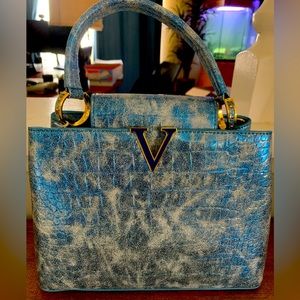 Blue and gold shoulder bag.